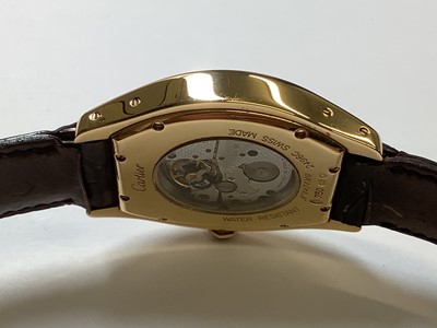 Lot 1004 - Cartier - a Tortue 18 carat yellow gold manual wind wristwatch.