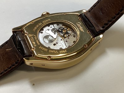 Lot 1004 - Cartier - a Tortue 18 carat yellow gold manual wind wristwatch.