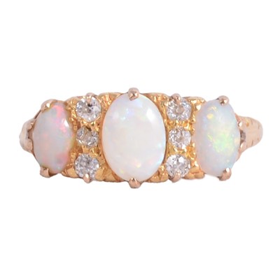 Lot 25 - An opal and diamond half hoop ring.