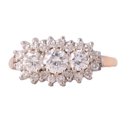 Lot 88 - An oval diamond cluster ring with three larger stones to centre.