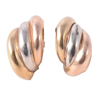 Lot 334 - A pair of yellow, red and white metal hoop earrings.