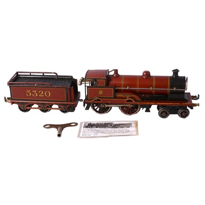 Lot 33 - Bing for Bassett-Lowke, O gauge clockwork model railway locomotive and tender "George V"