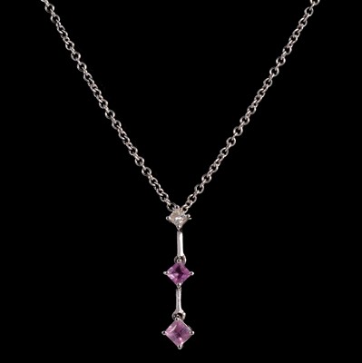 Lot 259 - A pink sapphire and diamond pendant.