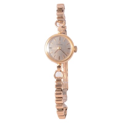 Lot 1061 - Omega - a lady's yellow metal manual wind wristwatch with 9 carat gold bracelet.