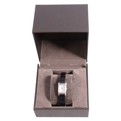 Lot 1073 - Gucci - a lady's stainless steel wristwatch with diamond set bezel.