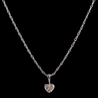 Lot 253 - A heart shaped diamond solitaire pendant and chain.