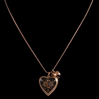 Lot 276 - A cultured pearl pendant on a chain, and a pique pendant.
