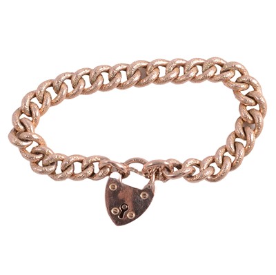Lot 193 - A rose metal hollow curb link bracelet with padlock fastener.