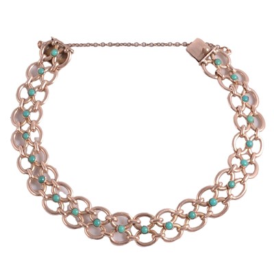 Lot 205 - A yellow bracelet set with small turquoise stones.