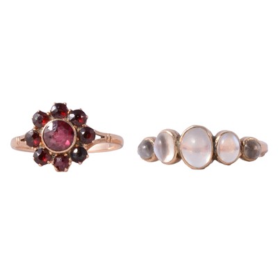 Lot 15 - A garnet ring and a moonstone ring.