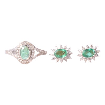 Lot 327 - An emeraldand diamond ring and pair of earstuds.
