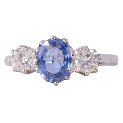 Lot 36 - A sapphire and diamond three stone ring.