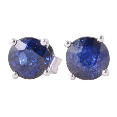 Lot 326 - A pair of sapphire solitaire stud earrings.