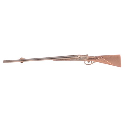 Lot 376 - A 9 carat rose and white gold side by side shotgun stock pin.