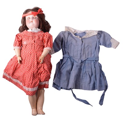 Lot 147 - A German bisque head doll with composition body and original clothes and one later outfit.