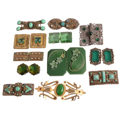 Lot 489 - Twelve Art Deco and later buckles set with green stones.