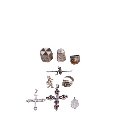 Lot 460 - Gemset white metal pendants, charm bracelet, loose charms, rings, brooch, thimbles, and pill box.