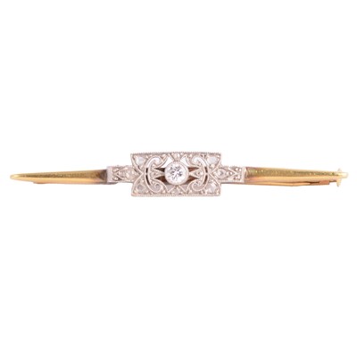 Lot 222 - A diamond set bar brooch.