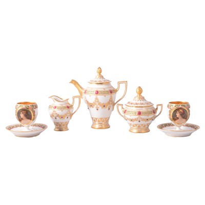 Lot 24 - A pair of Continental porcelain demitasse, three piece coffee set.