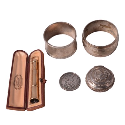 Lot 261 - A 9 carat gold cheroot holder, two napkin rings pill box and coin.