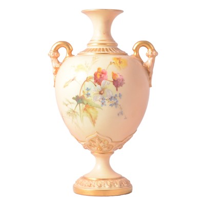 Lot 63 - A Royal Worcester twin handled pedestal shape vase.