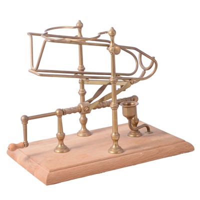 Lot 125 - Modern brass port cradle