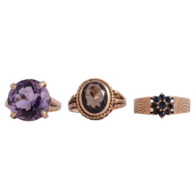 Lot 5 - Three gemset rings, amethyst, smoky quartz, sapphire.