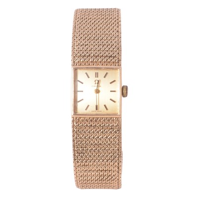 Lot 1058 - Omega - a lady's 9 carat yellow gold bracelet watch.