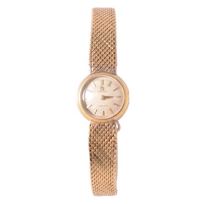 Lot 1059 - Omega - a lady's 18 carat yellow gold bracelet watch.