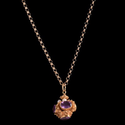 Lot 263 - An Italian Etruscan revival pendant/charm, circa 1970's, set with amethyst and chain.