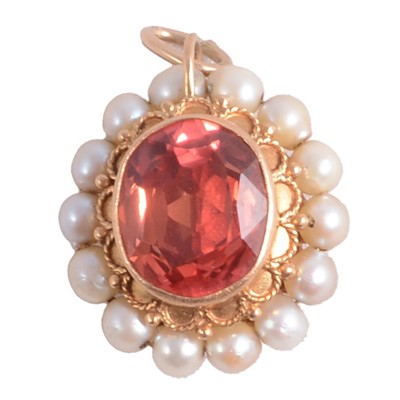 Lot 267 - A synthetic corundum and pearl double sided pendant.