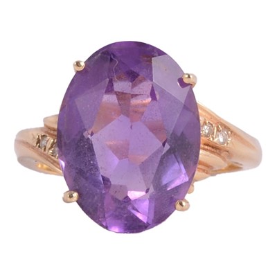 Lot 3 - An amethyst and diamond dress ring.