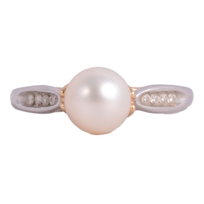 Lot 11 - A cultured pearl and diamond dress ring.