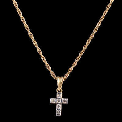 Lot 255 - A diamond set cross and chain.