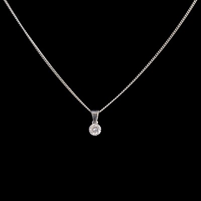 Lot 254 - A diamond solitaire pendant and chain.