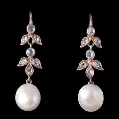 Lot 324 - A pair of pearl and diamond drop earrings.