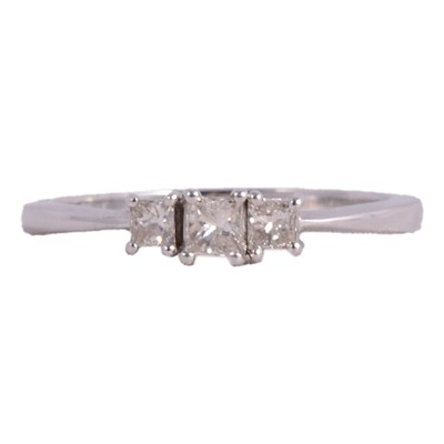 Lot 77 - A diamond three stone ring.