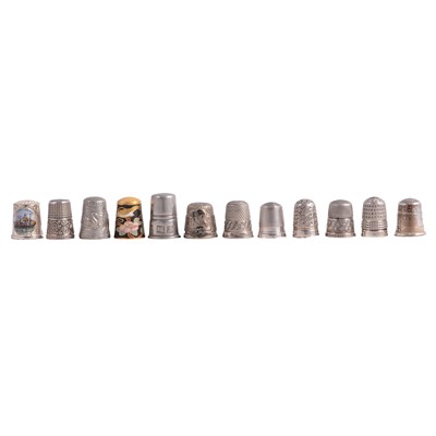 Lot 106 - Four silver thimbles and eight others