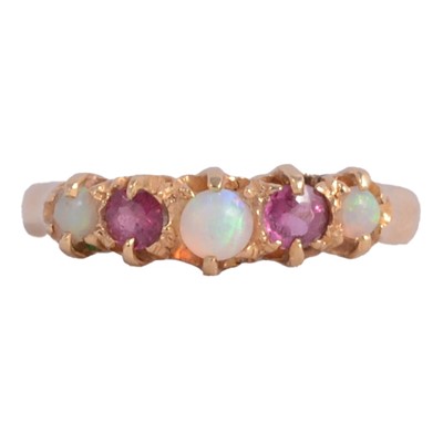 Lot 28 - A Victorian opal and ruby half hoop ring.