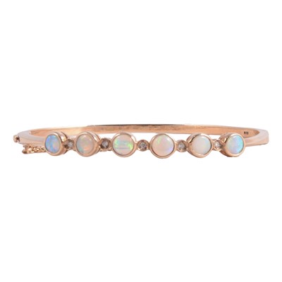 Lot 216 - An opal bangle.