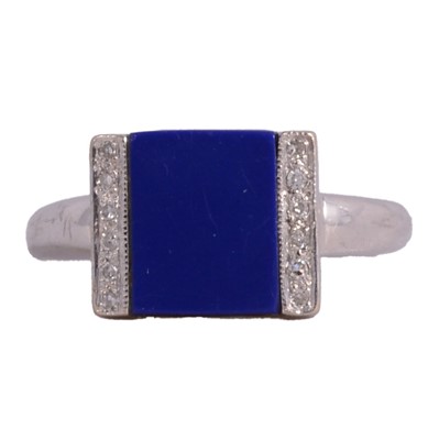 Lot 18 - A lapis lazuli and diamond dress ring.