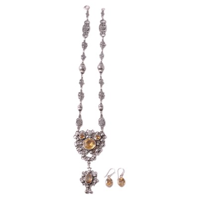 Lot 424 - A citrine pendant necklace and earrings.