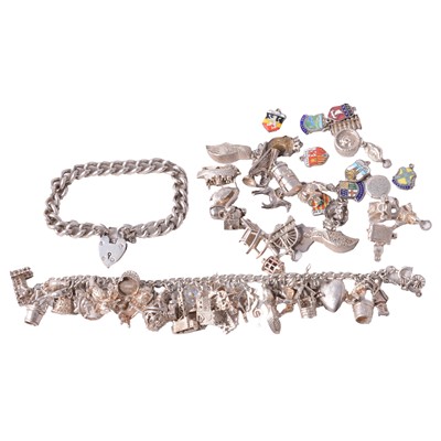 Lot 432 - Two silver charm bracelets with charms attached and loose.