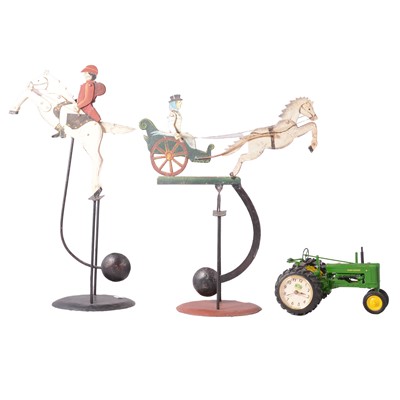 Lot 218 - Two vintage balancing toys, a John Deere tractor clock, and a Cunard Poster