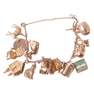 Lot 182 - A charm bracelet with charms. some hallmarked 9 carat gold.