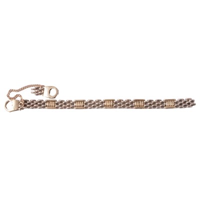 Lot 200 - A yellow and white metal bracelet marked 375, (link broken)