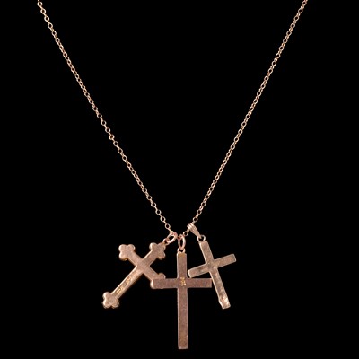 Lot 289 - Three crosses and chain and a hot diamond pendant, chain.