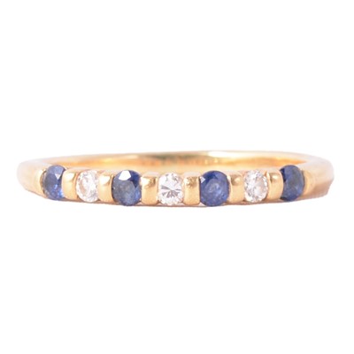Lot 39 - A sapphire and diamond half eternity ring.