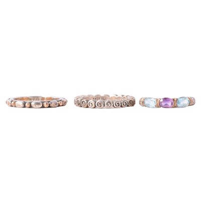 Lot 110 - A gemset dress ring and two silver Pandora rings.