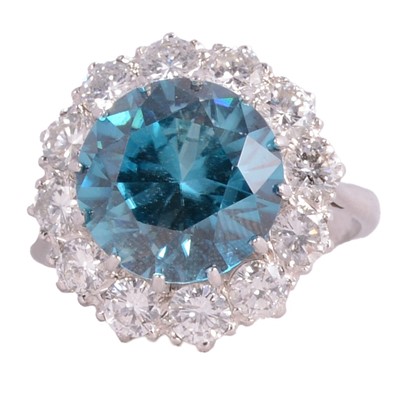 Lot 62 - A heat treated blue zircon and diamond cluster ring.